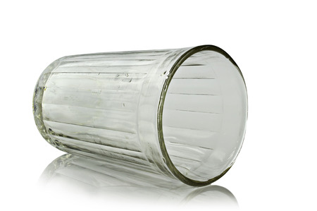 faceted glass lying on its side on a white backgroundの写真素材