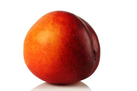 Ripe juicy nectarine on a white background.の写真素材