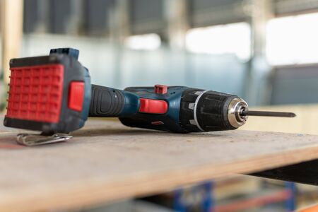 cordless drill, screwdriver, on scaffolding