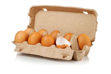 Raw brown chicken eggs in a cardboard box on a white background.