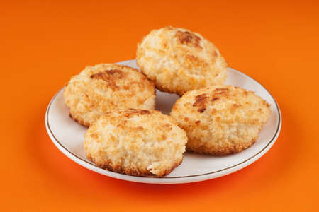 Four mouth-watering, delicious cookies with coconut crumbs