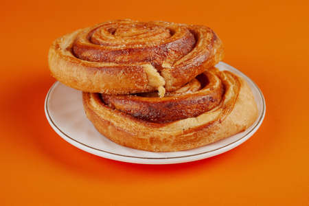 Delicious pastries, sweet curls, on a white plate