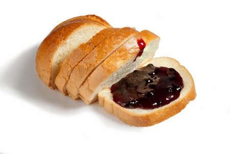 Slices of bread and sweet fragrant blueberry jam on a white background