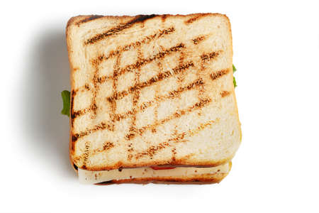 Sandwich with smoked meat, cheese and vegetables on a white background.