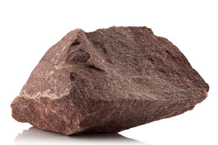 A stone, a rough fragment of crimson quartzite on a white backgroundの写真素材
