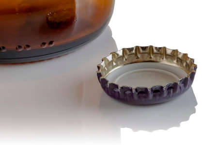 Beer bottle cap on white background