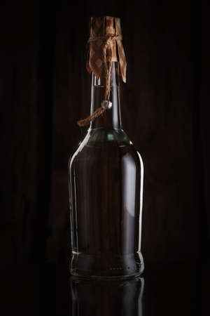A bottle of vodka on a dark background.の写真素材