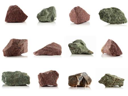 Stones, pieces of rock, granite, quartzite, jadeite on a white background.の写真素材