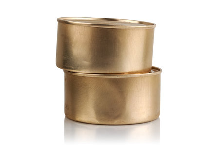 Two tin cans with food on a white backgroundの写真素材