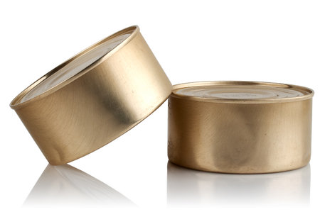 Two tin cans with food on a white backgroundの写真素材