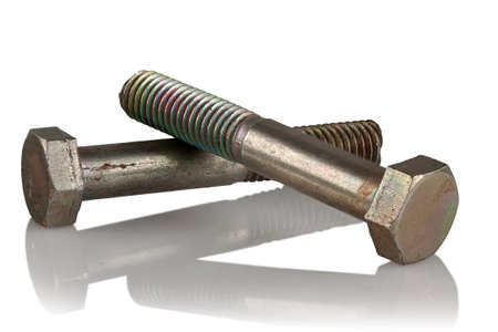 Two steel bolts on a white reflective backgroundの写真素材