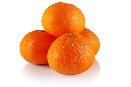 Four ripe tangerines close-up on a white backgroundの写真素材