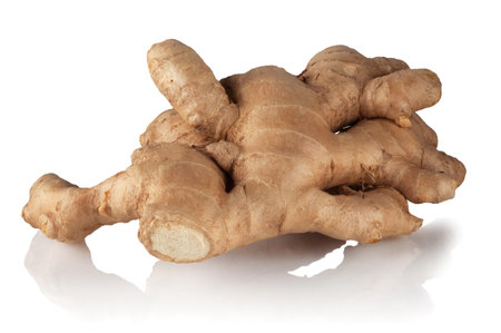 Ginger root on a white reflective background.の写真素材