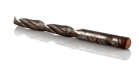 Old, rusty steel drill bit on a white backgroundの写真素材