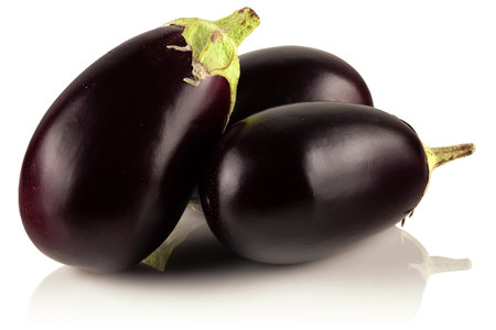 Three ripe, fresh eggplants on a white background.の写真素材
