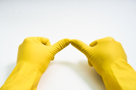 hands in yellow rubber glovesの写真素材