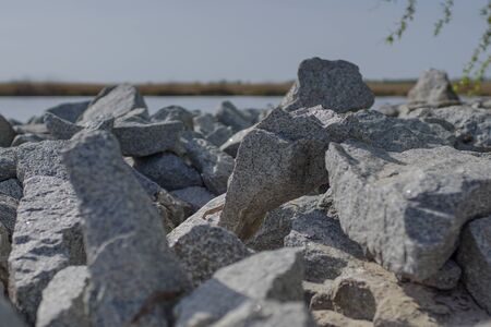 the stones on the river Bank on a Sunny dayの写真素材