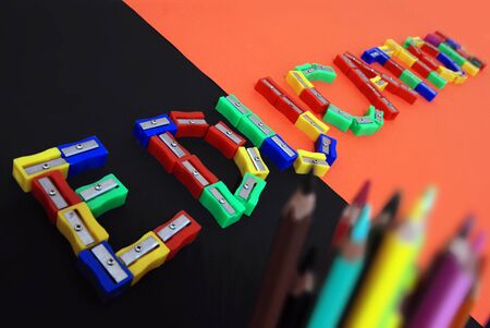 The word education is made up of pencil sharpeners on the table