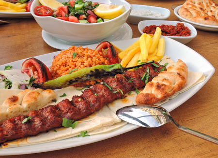 Photo image of grilled traditional turkish kebab and pita with saladの写真素材