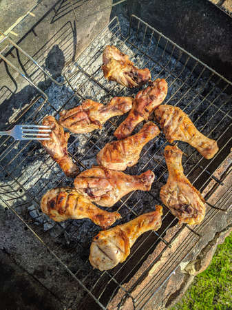 photo image of the hot grilled poultry drumsticks on the grillの写真素材