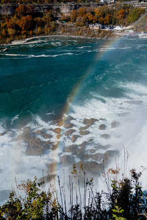 Niagara Falls from the American and Canadian sides. Rainbow over the waterfall. The most popular tourist place. Stormy river that flows into the lake.の写真素材
