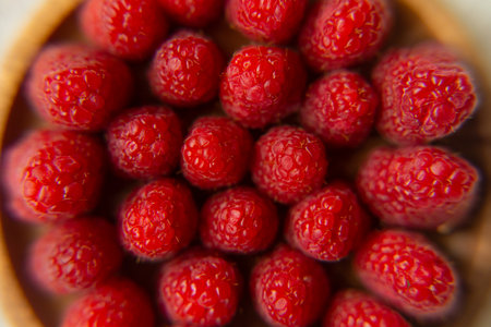Raspberry close-up on a beautiful stand, summer fruit.の写真素材