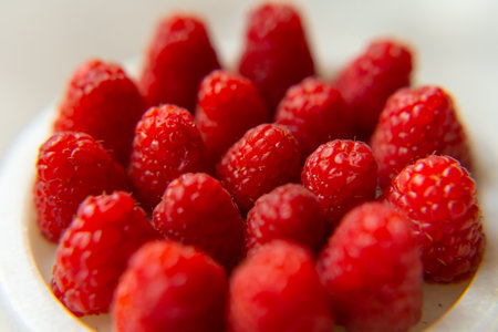 Raspberry close-up on a beautiful stand, summer fruit.の写真素材