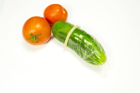 green cucumber in pimples on a white backgroundの写真素材