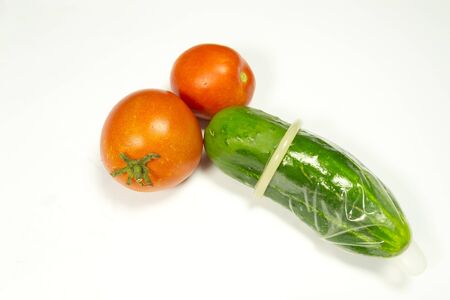 cucumber and two tomatoesの写真素材