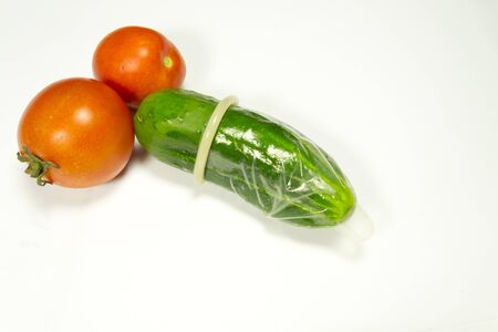 cucumber and two tomatoesの写真素材