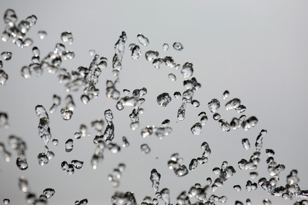 drops of the fountain in the skyの写真素材