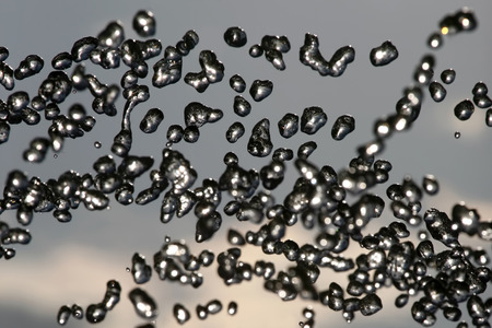 drops of the fountain in the skyの写真素材