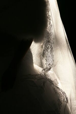 the outline of the wedding dress in the sunlightの写真素材