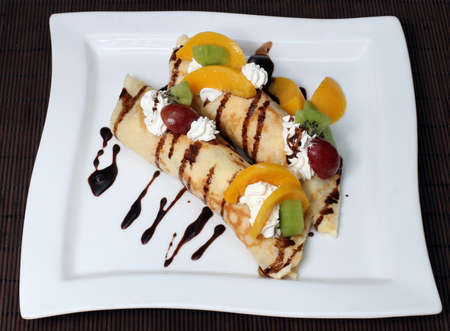 dessert and pancakes and fruit in creamの写真素材
