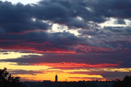very bright sunset over the cityの写真素材