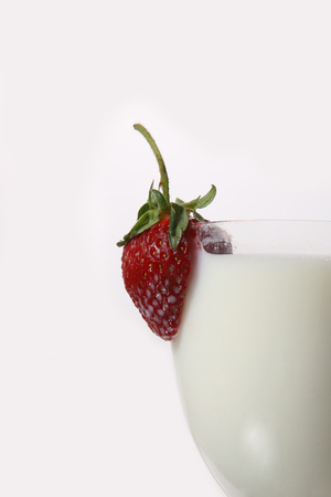 strawberry on the glass with milkの写真素材