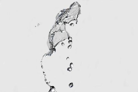 drops of water fountain closeup on a light backgroundの写真素材