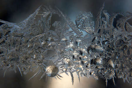 unusual frost on a winter windowの写真素材