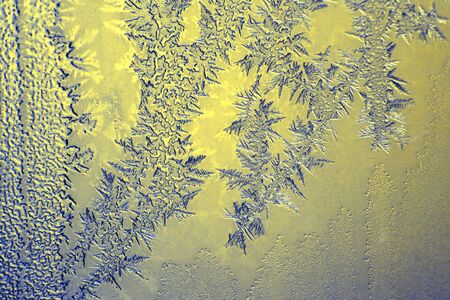 the unusual frost on a winter windowの写真素材