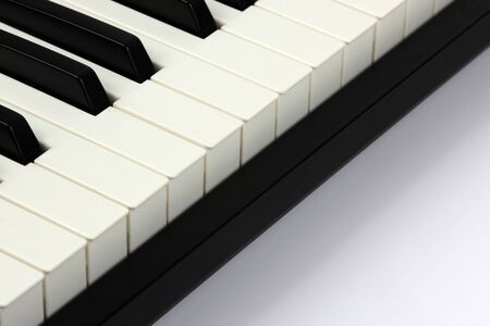 the piano keys closeup on white backgroundの写真素材