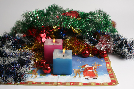 two burning candles with new year decorationの写真素材