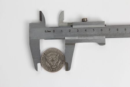 measurement of the caliper of the coin sizeの写真素材