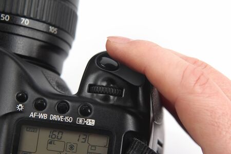 the finger is near the trigger button is digital camera close upの写真素材