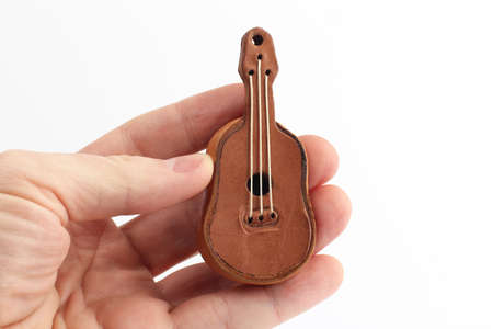 toy souvenir in the form of a small leather guitarの写真素材