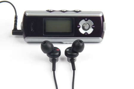 the audio headphones are small in the case of the music playerの写真素材