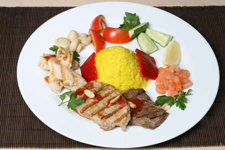 several kinds of meat with rice and vegetablesの写真素材