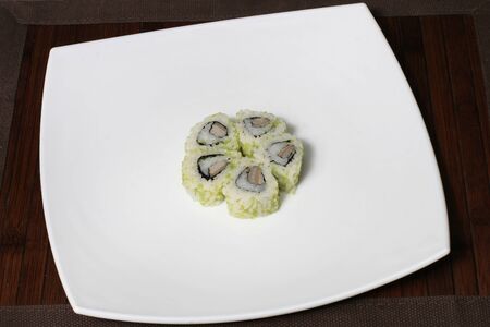 the portion sushi on a large square white plateの写真素材