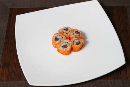 the portion sushi on a large square white plateの写真素材