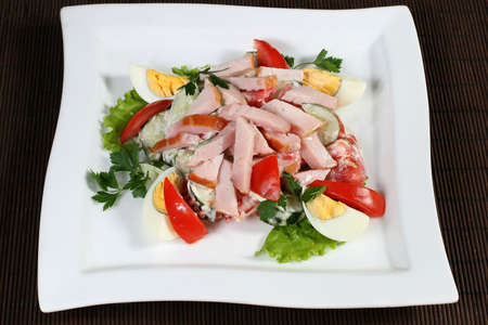 the salad of ham and eggs with vegetablesの写真素材