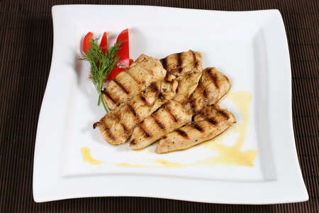 the grilled succulent meat with vegetablesの写真素材